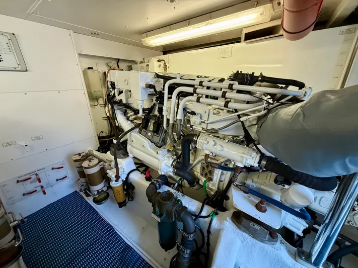  Yacht Photos Pics Engine room of 2001 West Bay Sonship 58 Pilothouse yacht, showcasing detailed machinery.