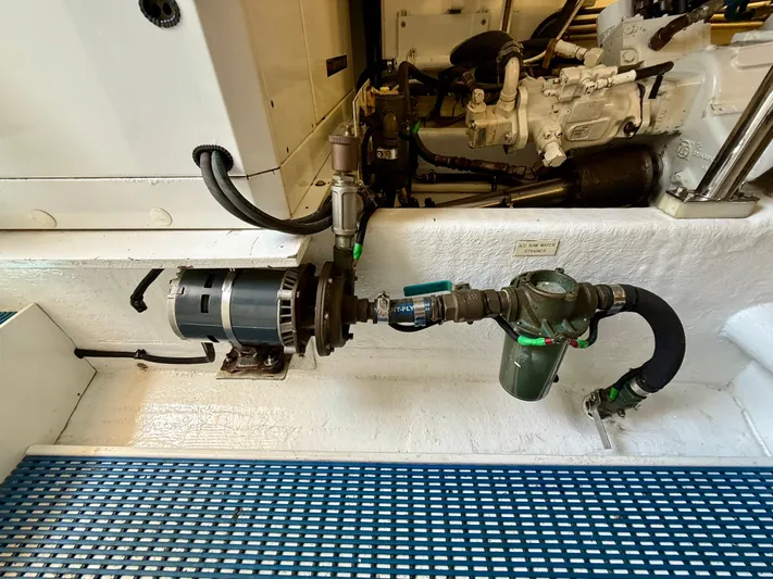  Yacht Photos Pics Engine room of 2001 West Bay Sonship 58 Pilothouse, featuring mechanical components and water strainer.