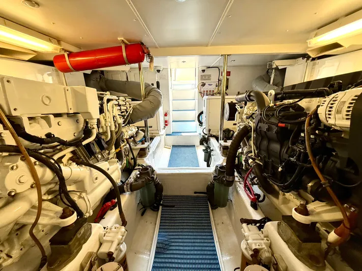  Yacht Photos Pics Engine room of 2001 West Bay Sonship 58 Pilothouse yacht, showcasing machinery and equipment.