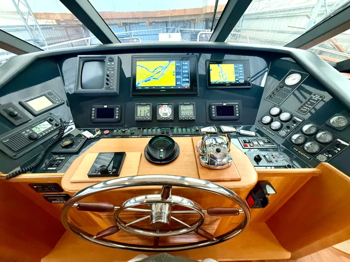  Yacht Photos Pics Pilothouse of 2001 West Bay Sonship 58, featuring navigation equipment and steering wheel.