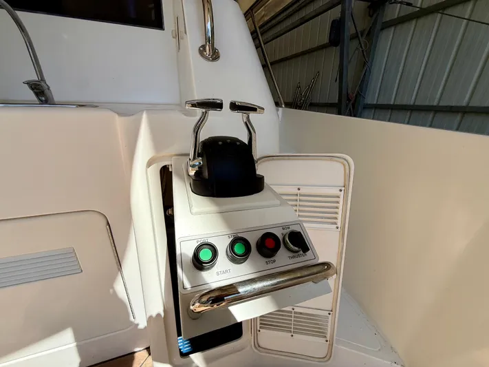  Yacht Photos Pics Control panel of a 2001 West Bay Sonship 58 Pilothouse yacht, featuring start and stop buttons.