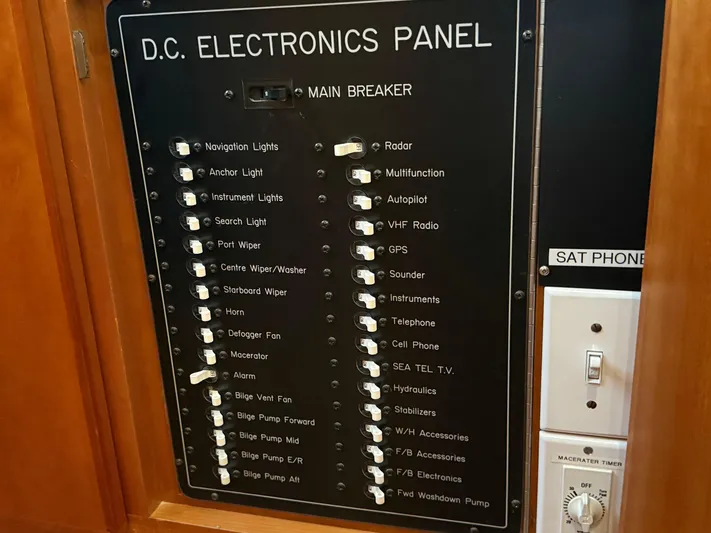  Yacht Photos Pics D.C. electronics panel on 2001 West Bay Sonship 58 Pilothouse yacht, featuring various switches and controls.