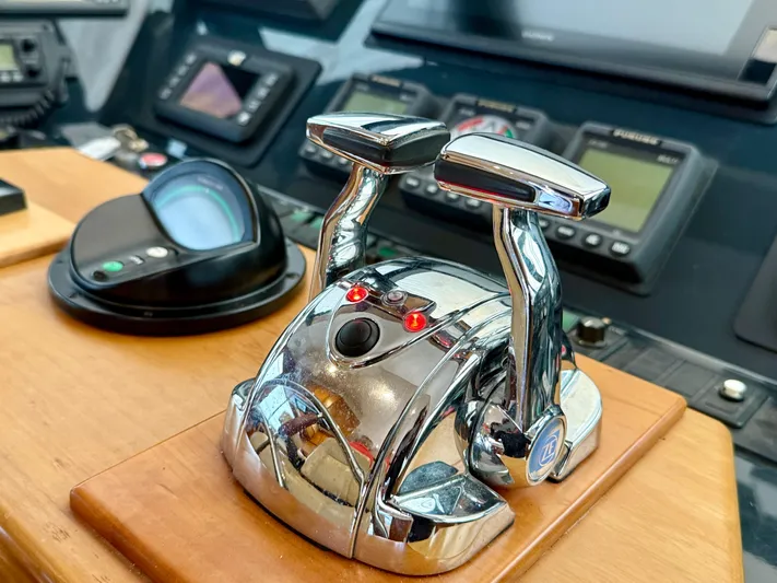  Yacht Photos Pics Control panel of 2001 West Bay Sonship 58 Pilothouse yacht with chrome throttle levers.