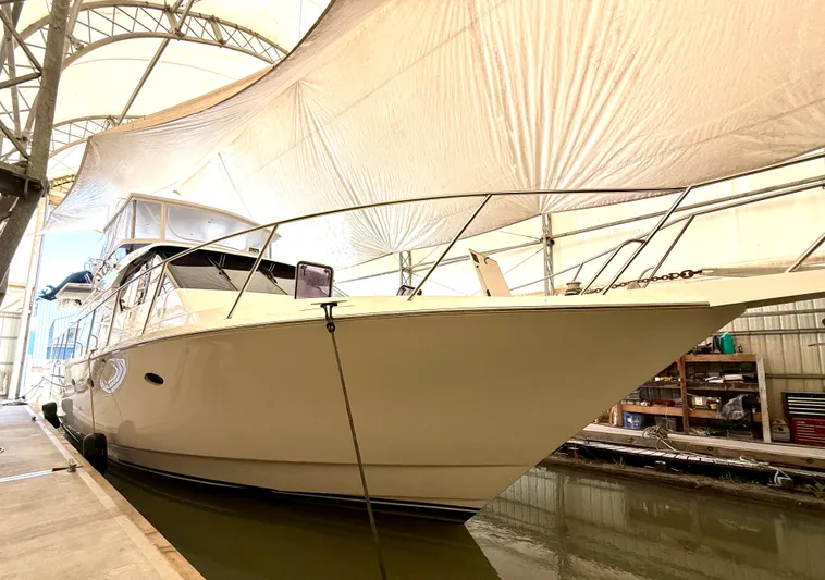  Yacht Photos Pics 2001 West Bay Sonship 58 Pilothouse yacht docked in a covered marina.