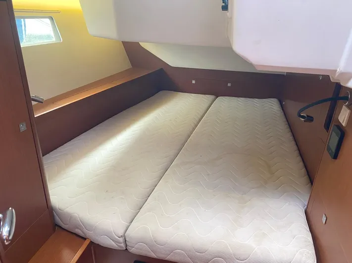  Yacht Photos Pics Interior cabin of 2014 Beneteau Oceanis 45 yacht with twin mattresses.