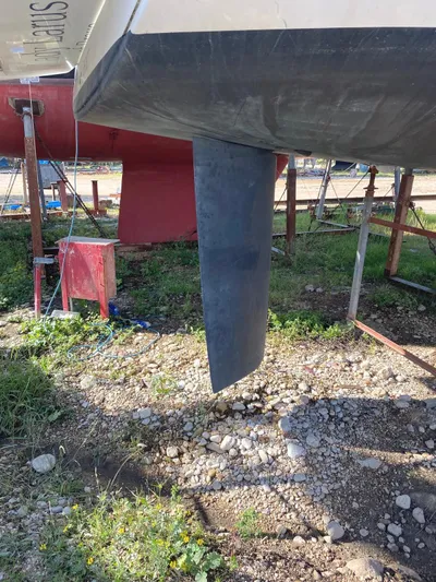  Yacht Photos Pics 2014 Beneteau Oceanis 45 sailboat keel on dry dock, showcasing hull and rudder.