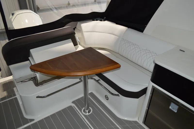  Yacht Photos Pics 2023 Sea Ray DAO 370 interior with elegant seating and wooden table.