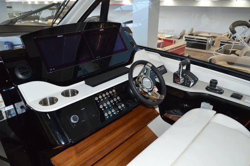  Yacht Photos Pics 2023 Sea Ray DAO 370 helm with modern controls, sleek dashboard, and luxurious seating.
