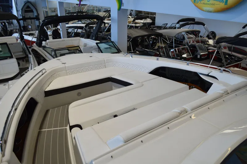  Yacht Photos Pics 2023 Sea Ray DAO 370 boat interior with sleek white seating in showroom.