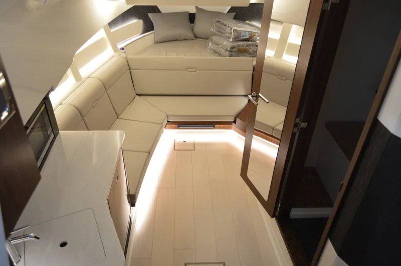  Yacht Photos Pics Luxurious interior of 2023 Sea Ray DAO 370 yacht with modern seating and ambient lighting.