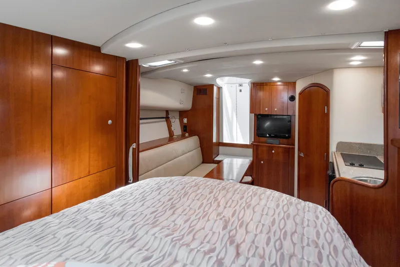 Loose Screws Yacht Photos Pics Luxurious interior of 2011 Rampage 34 Express yacht with wood finish and modern amenities.
