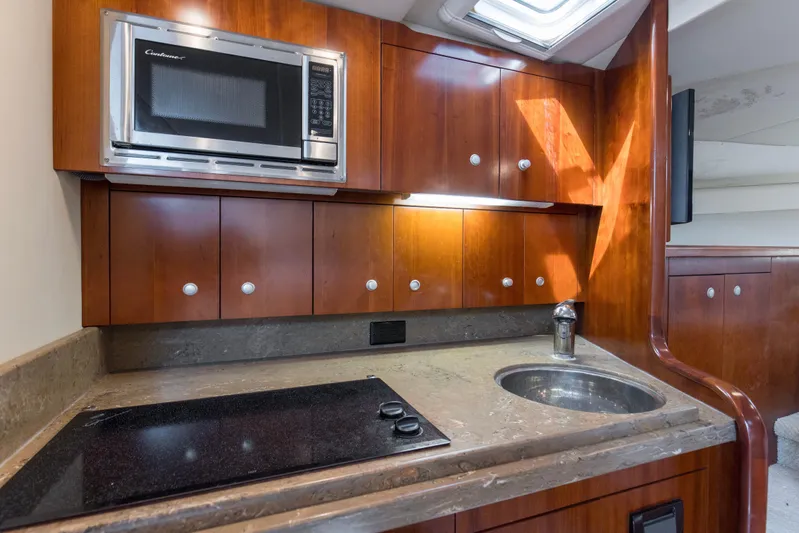 Loose Screws Yacht Photos Pics 2011 Rampage 34 Express yacht kitchen with microwave, stove, and sink.