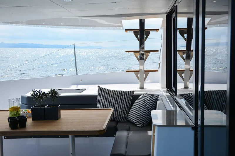  Yacht Photos Pics Luxurious 2020 Dufour Catamarans 48 interior with ocean view and elegant seating area.