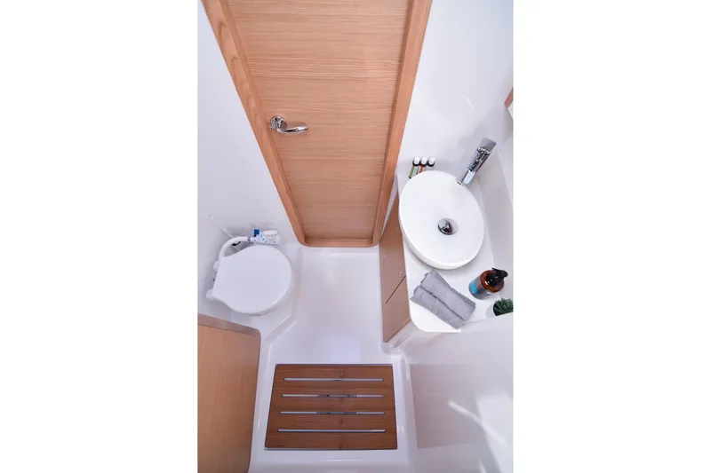  Yacht Photos Pics Modern bathroom in 2020 Dufour Catamarans 48, featuring sleek sink and toilet.