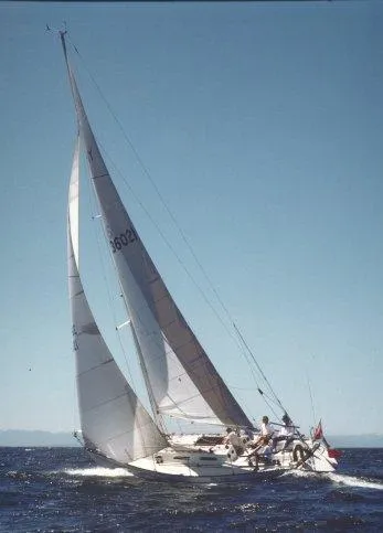 1982 Schock NY 36 sailboat navigating open waters.