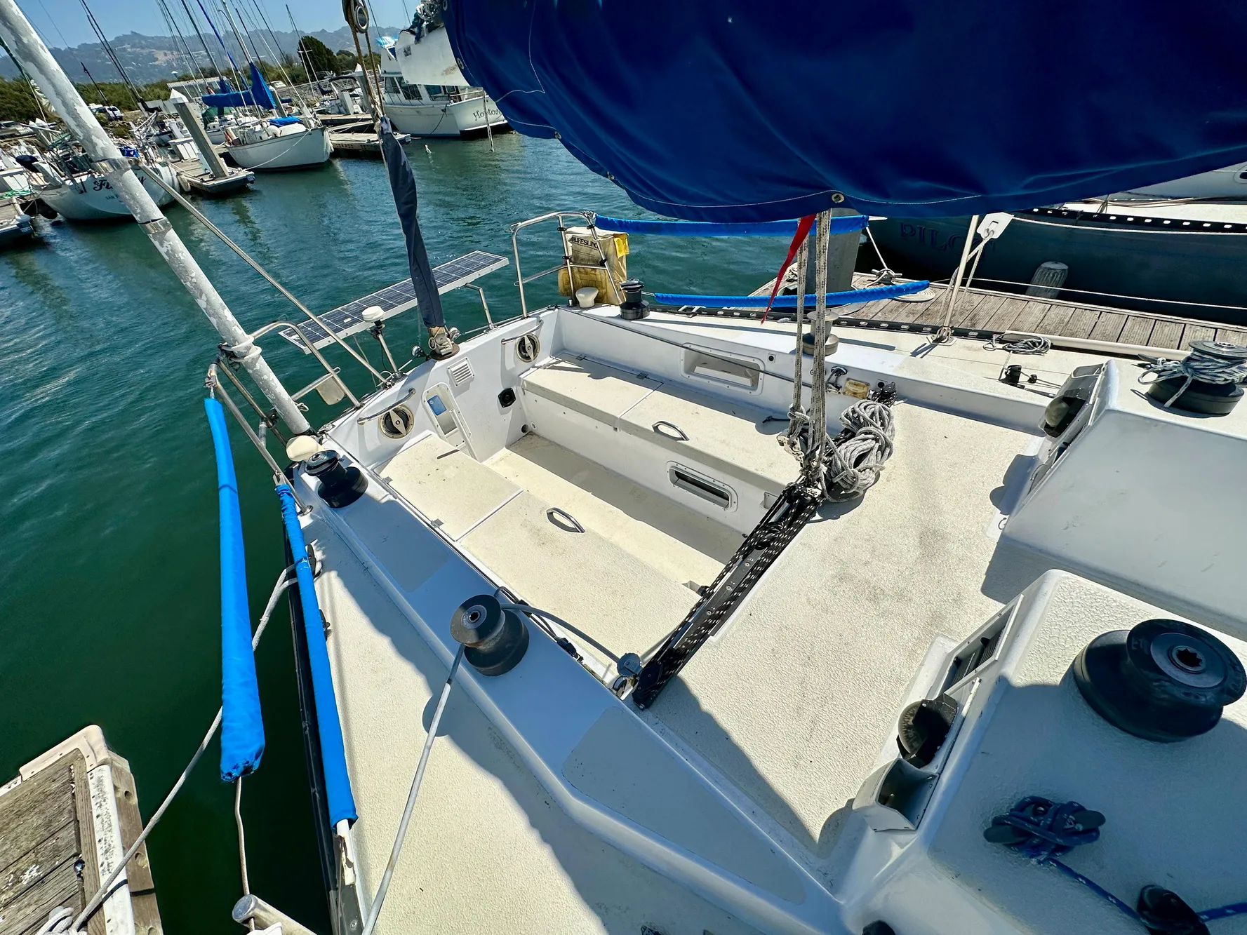 1982 Schock NY 36 sailboat docked in marina.