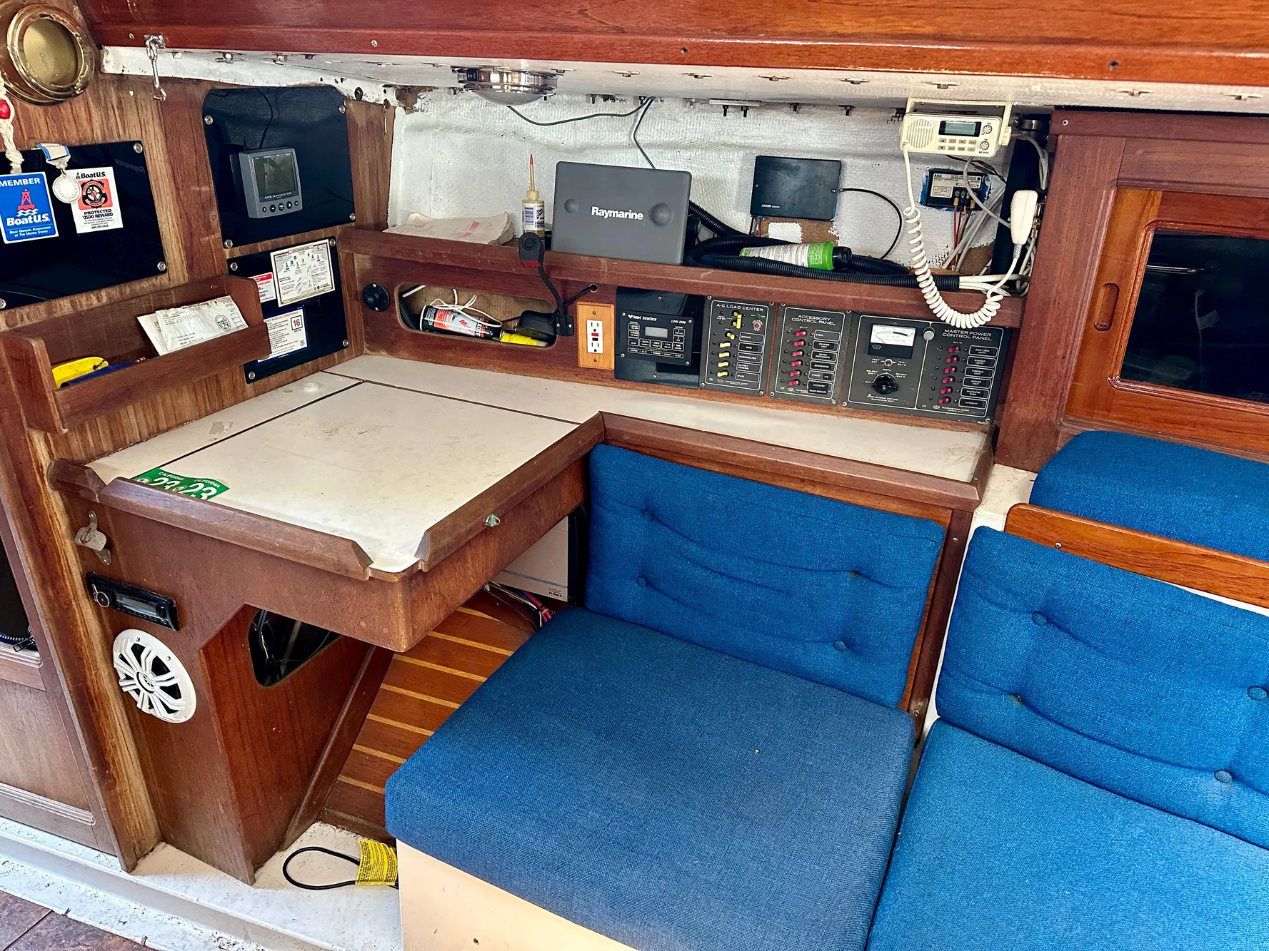 Interior of a 1982 Schock NY 36 yacht with blue seating.