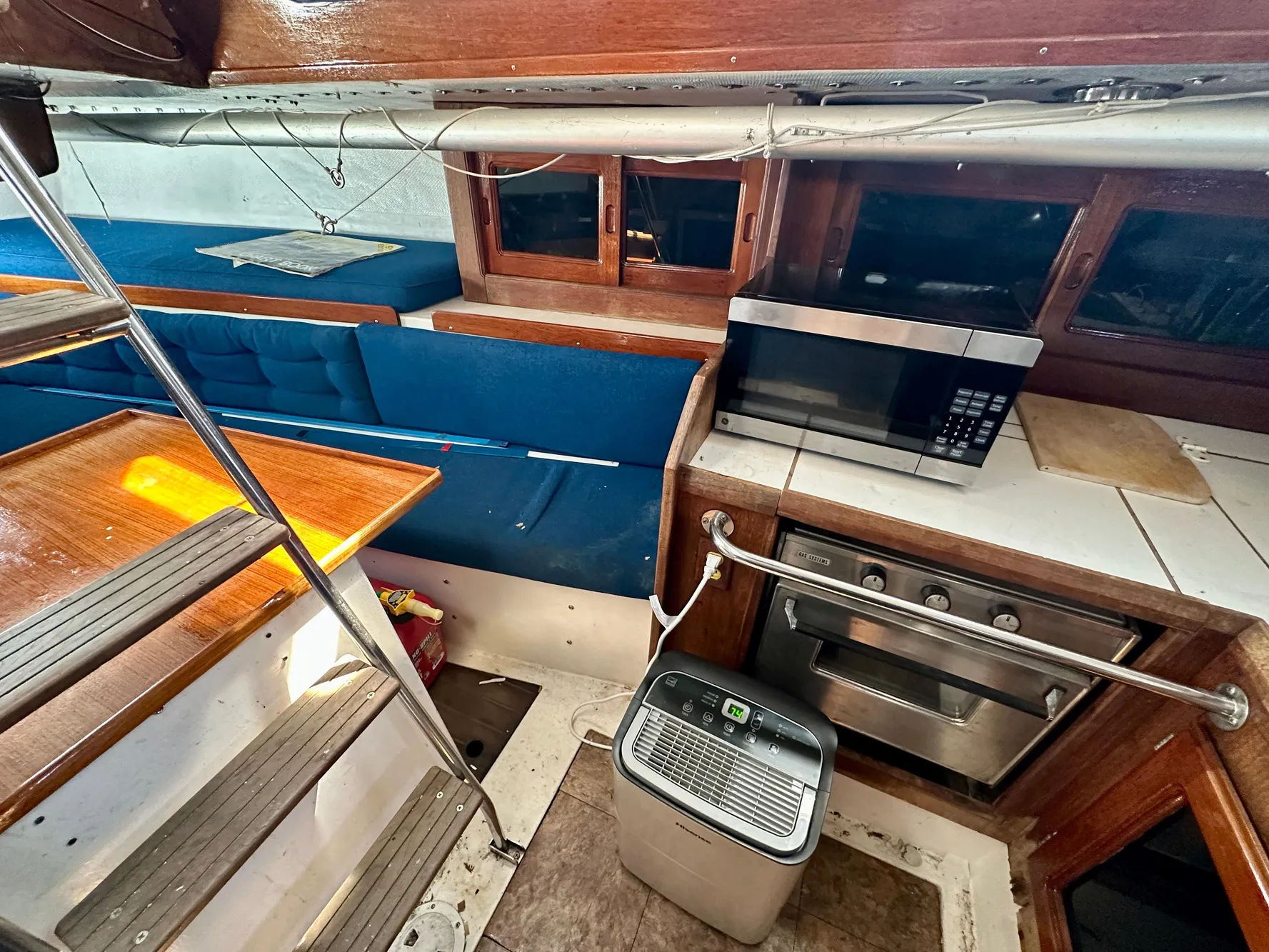 Interior of a 1982 Schock NY 36 yacht with kitchen and seating area.