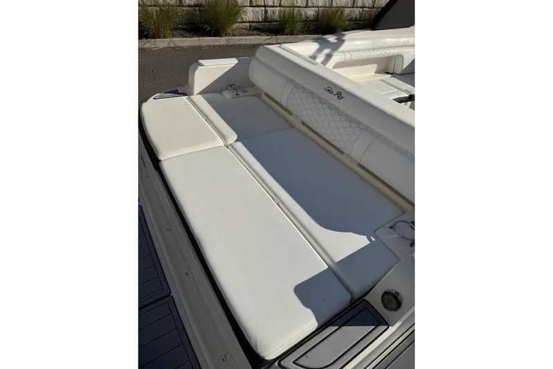  Yacht Photos Pics 2019 Sea Ray SDX 290 Outboard boat with white cushioned seating area.