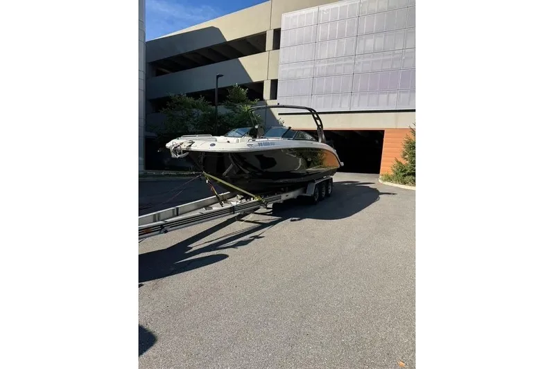  Yacht Photos Pics 2019 Sea Ray SDX 290 Outboard boat on trailer, parked outdoors.