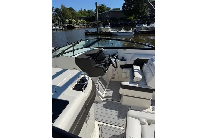  Yacht Photos Pics 2019 Sea Ray SDX 290 Outboard boat interior with helm, seating, and waterfront view.