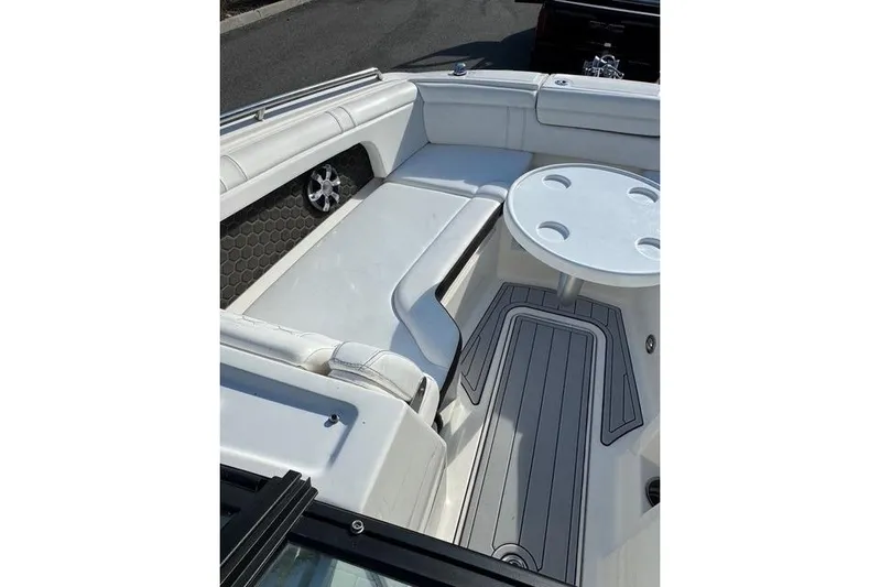  Yacht Photos Pics 2019 Sea Ray SDX 290 Outboard boat interior with white seating and round table.