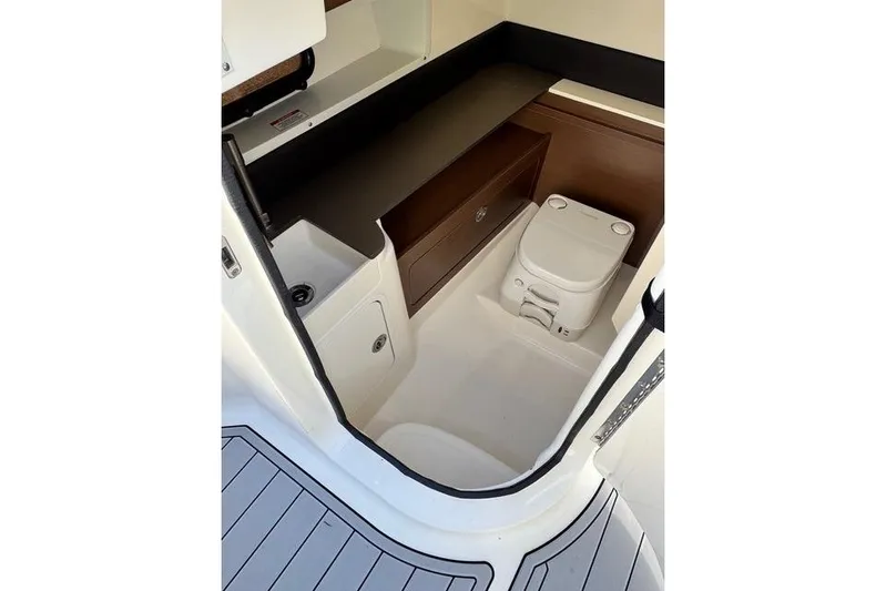  Yacht Photos Pics 2019 Sea Ray SDX 290 Outboard interior with compact marine toilet and storage.