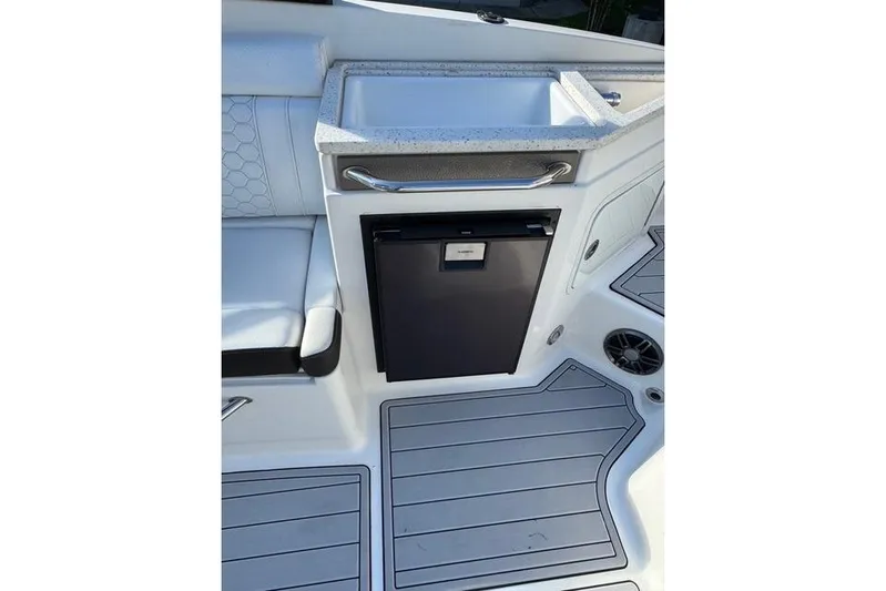  Yacht Photos Pics 2019 Sea Ray SDX 290 Outboard boat interior with sink and storage compartment.