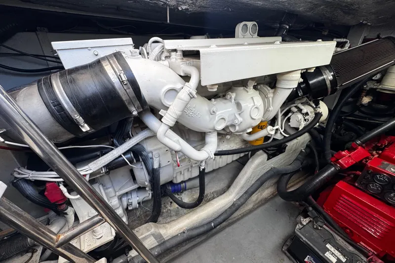  Yacht Photos Pics Engine compartment of a 1999 Sea Ray 440 Express Bridge boat, showcasing mechanical components.