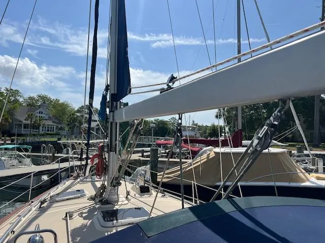  Yacht Photos Pics Sailboat Island Packet 380, 1999 model, docked at marina under clear blue sky.