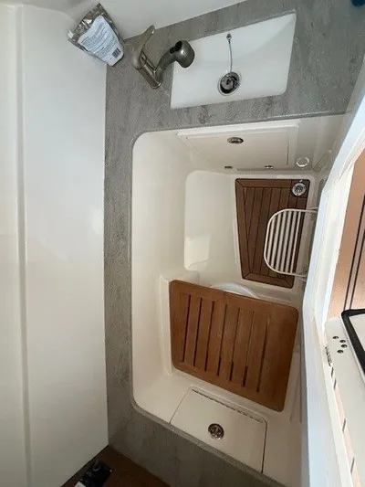  Yacht Photos Pics Interior of 2017 Boston Whaler 320 Vantage with sink and wooden flooring.
