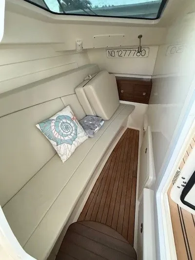  Yacht Photos Pics Interior of 2017 Boston Whaler 320 Vantage with seating and cushions.