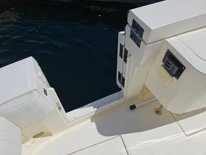  Yacht Photos Pics 2001 Carolina Classic Express 35 boat deck with seating and storage compartments.