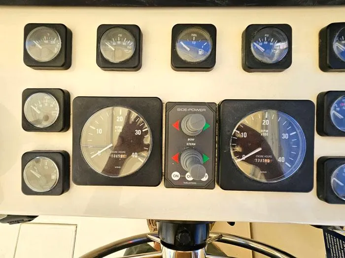  Yacht Photos Pics Dashboard of a 2001 Carolina Classic Express 35 boat with various gauges and controls.