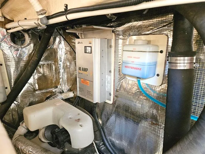  Yacht Photos Pics Engine room of 2001 Carolina Classic Express 35 with electrical and cooling components.