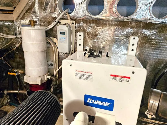  Yacht Photos Pics Engine room of 2001 Carolina Classic Express 35 with Cruisair unit and equipment.