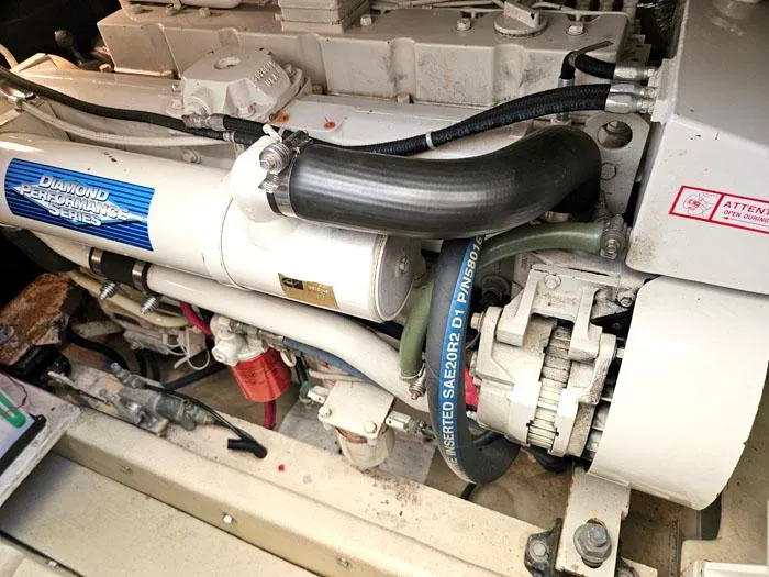  Yacht Photos Pics Engine of a 2001 Carolina Classic Express 35 boat, showcasing mechanical components.