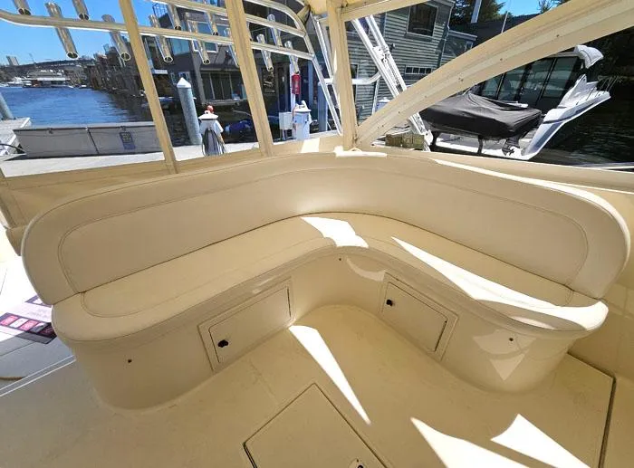  Yacht Photos Pics Interior seating of 2001 Carolina Classic Express 35 boat, featuring cream-colored upholstery.