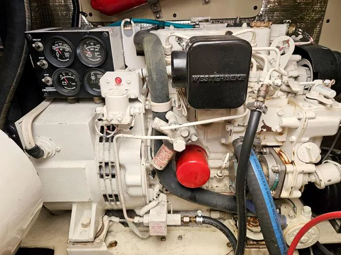  Yacht Photos Pics Engine compartment of a 2001 Carolina Classic Express 35 boat, featuring gauges and hoses.