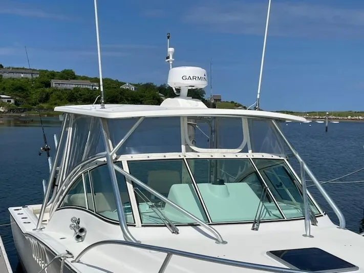  Yacht Photos Pics 2008 Albemarle 31 boat docked, featuring Garmin radar, clear skies, and scenic waterfront.