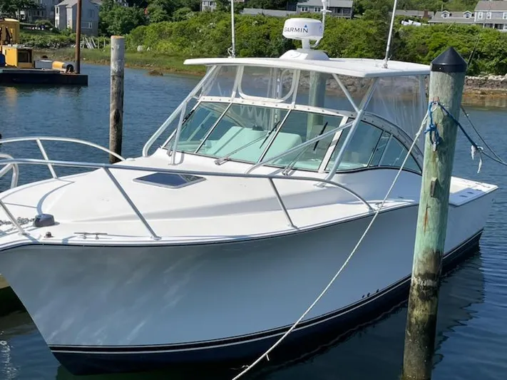  Yacht Photos Pics 2008 Albemarle 31 boat docked in a serene marina setting.