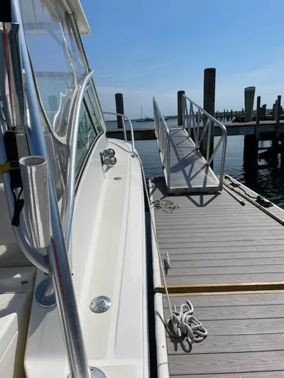  Yacht Photos Pics 2008 Albemarle 31 boat docked at a marina with clear blue skies.