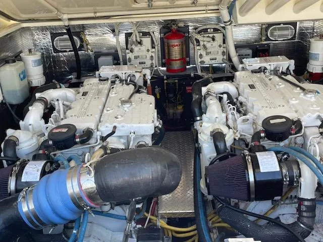  Yacht Photos Pics Engine room of a 2008 Albemarle 31 boat with dual engines and fire extinguisher.