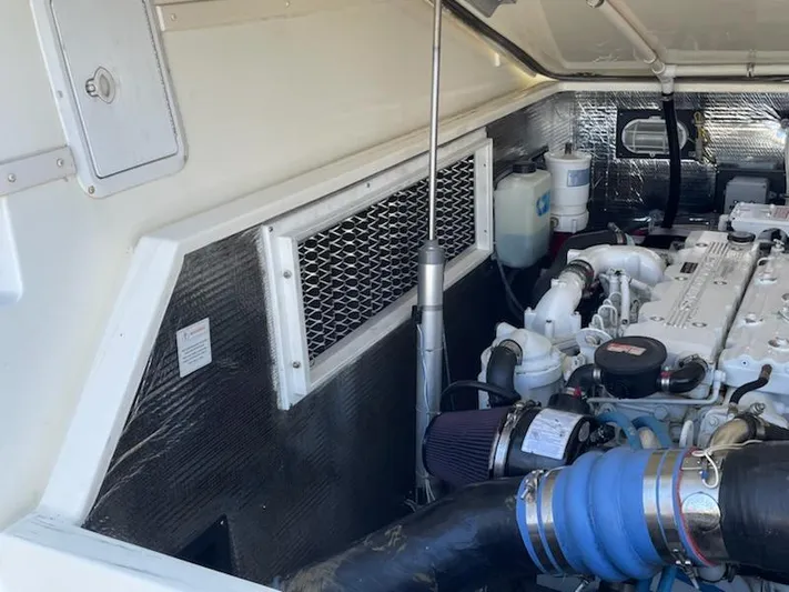  Yacht Photos Pics Engine compartment of a 2008 Albemarle 31 boat, showcasing mechanical components and ventilation.