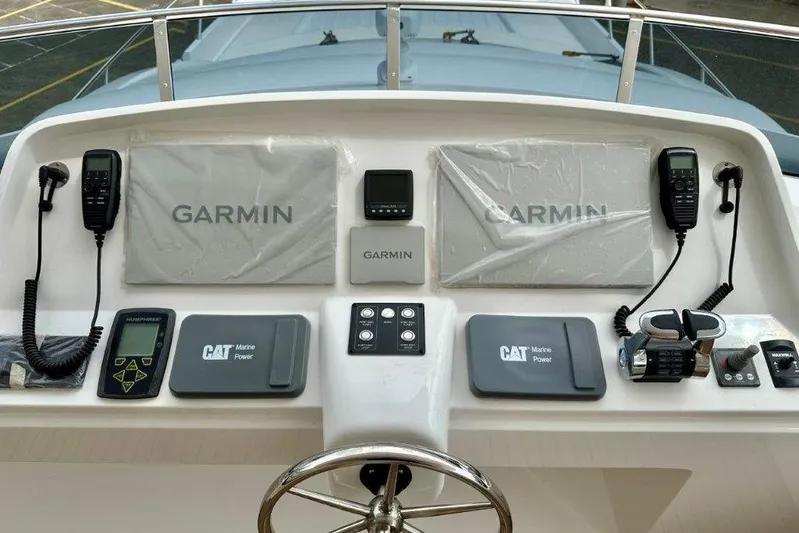  Yacht Photos Pics Control panel of Lanzarote 7702 yacht featuring Garmin and CAT Marine Power systems.