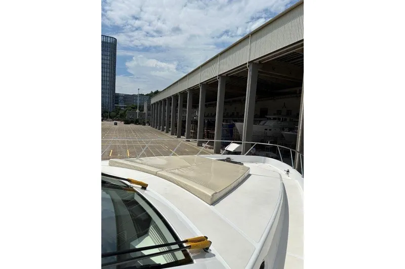  Yacht Photos Pics Front deck of Lanzarote 7702 yacht, 2025 model, near a large industrial building.