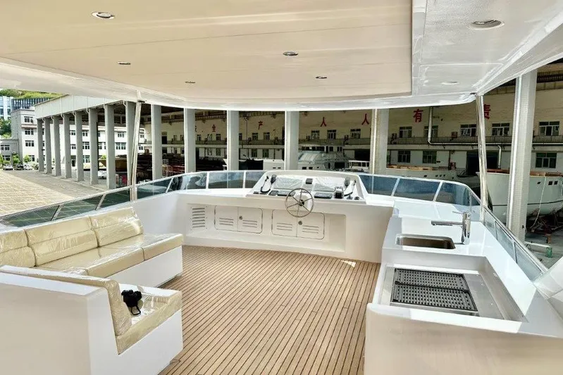  Yacht Photos Pics Luxurious Lanzarote 7702 yacht interior, featuring modern seating and helm, 2025 model.