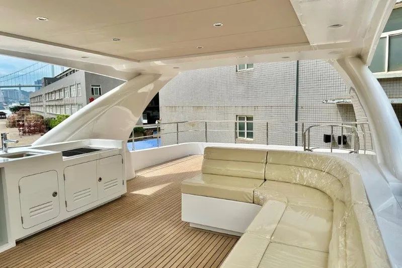  Yacht Photos Pics Luxurious Lanzarote 7702 yacht deck with modern seating and kitchenette, 2025 model.
