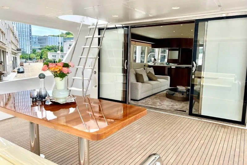  Yacht Photos Pics Luxurious Lanzarote 7702 yacht interior with elegant wooden table and modern decor, 2025 model.