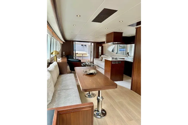  Yacht Photos Pics Luxurious interior of 2025 Lanzarote 7702 yacht with elegant wood finishes and modern furnishings.
